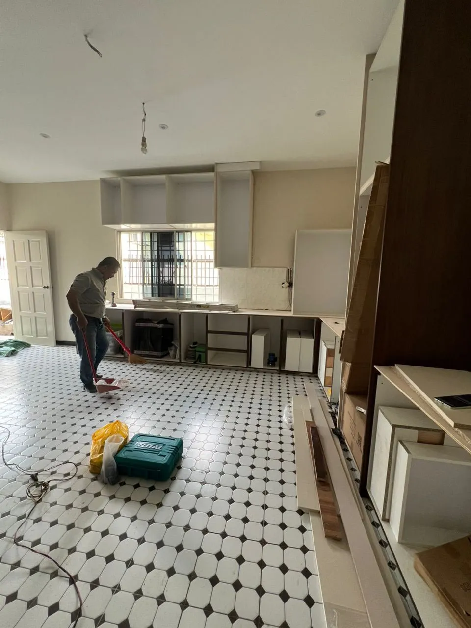 Kitchen cabinet installation at 80 percent